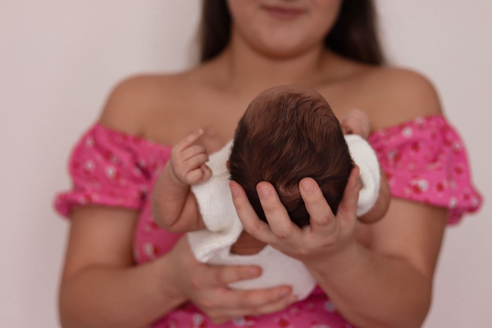 A mother holding her newborn baby