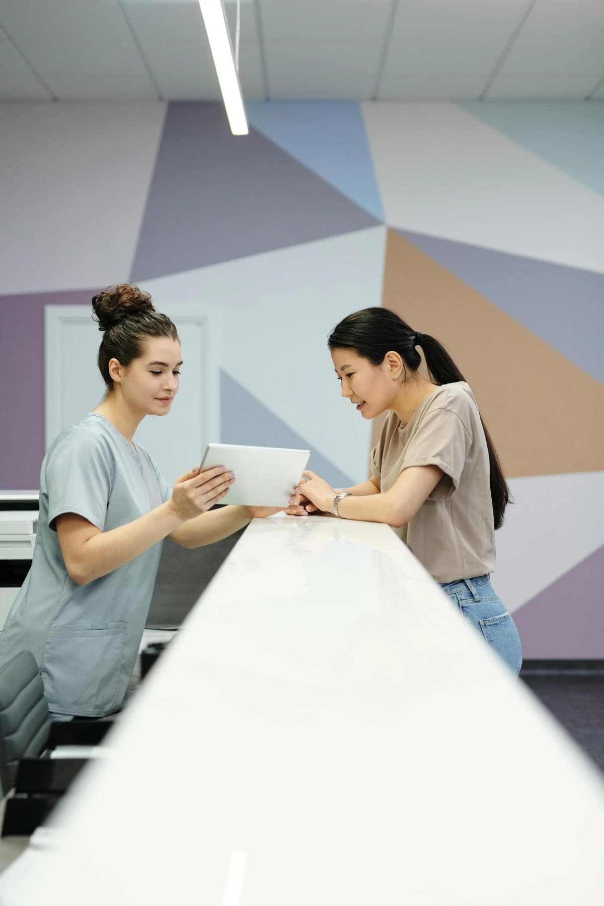 A clinician and a woman reviewing her care together